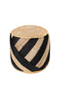 Round handwoven pouf made of black and natural jute with diagonal stripes, perfect for seating or decorative use in rustic interiors.