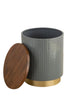 Modern cylindrical side table with a removable wooden top, ribbed gray body, and gold metallic base, featuring hidden storage inside.