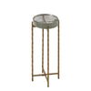 Elegant accent table with a round clear top, supported by twisted gold metal legs, offering a modern and stylish design for interiors