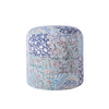 Round pouf with floral and paisley patchwork in blue and green tones, featuring intricate designs for an elegant decorative touch.