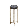 Tall round accent table with a black top and gold twisted metal legs, offering a sleek and modern design for elegant interiors.