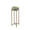 Full view of the green round accent table with four gold legs and a cross support design.