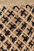 Close-up of woven jute fibers with black interlaced accents, showcasing intricate craftsmanship for eco-friendly decor or seating.