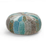 Round colorful patchwork pouf featuring vibrant blue, teal, and orange patterns with stitched details, ideal for bohemian decor.