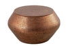 Hammered copper coffee table with a round top and unique texture, perfect for adding warmth and elegance to living spaces.