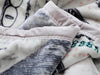 Detailed close-up of the durable stitching and soft plush fleece of the Hiyoko money blanket.