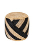 Handwoven round jute pouf with natural and black striped pattern, ideal for eco-friendly seating and decor in modern or rustic interiors.