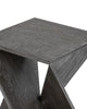 Close-up of a gray wooden accent table with a twisted geometric design, showcasing its textured surface and modern craftsmanship