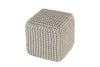 Beige cube-shaped pouf with a woven knit design, offering a stylish and functional seating option for modern or casual living spaces.