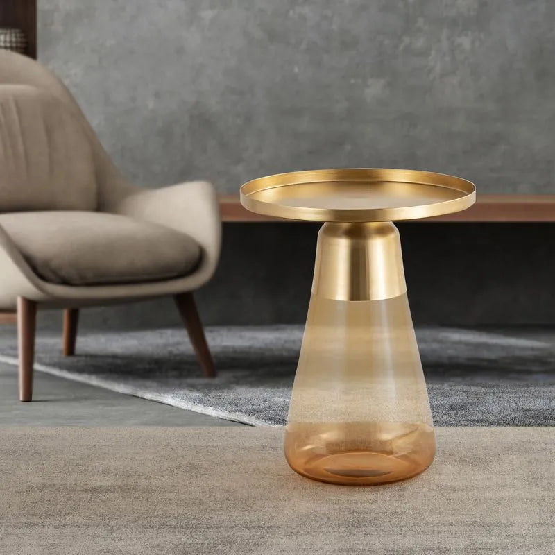 Amber round-top side table with a warm amber glass base, styled in a contemporary living room for a luxurious touch.