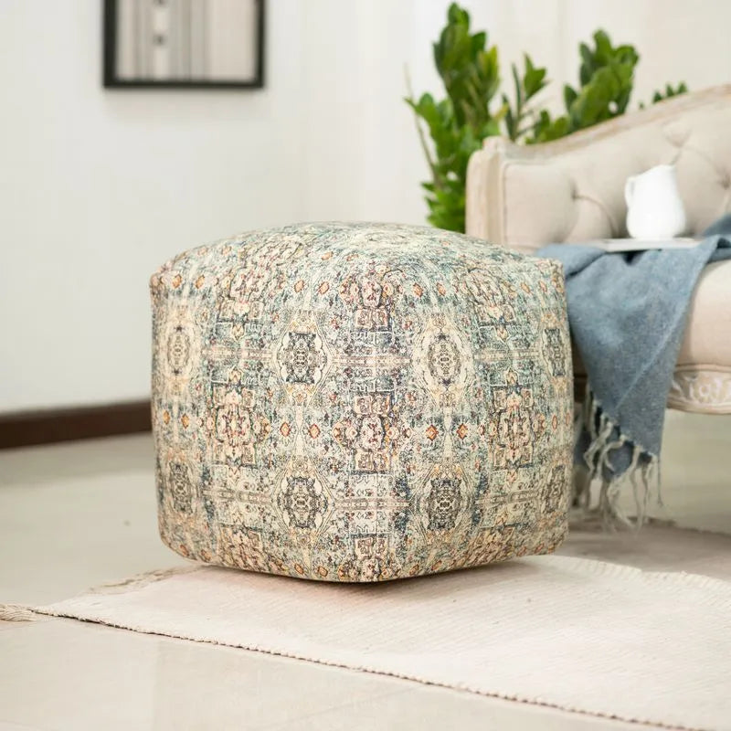 Beige pouf with intricate designs, made from 100% cotton, adding elegance and comfort to any living space or seating area.