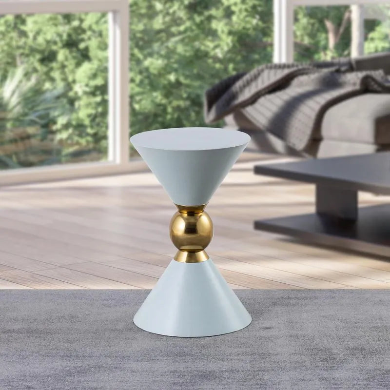 Elegant mint hourglass accent table with a gold centerpiece, displayed in a modern living room with natural light and mint.