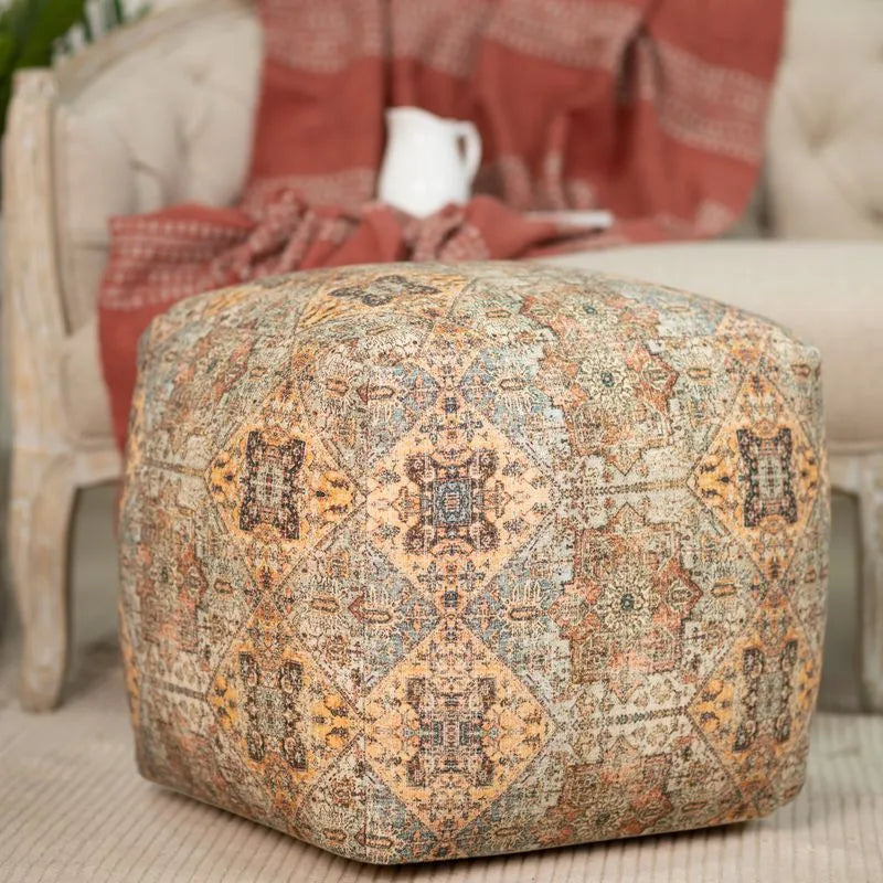 Brown pouf with intricate patterns, made of 100% cotton, perfect for adding a warm and stylish touch to living spaces.